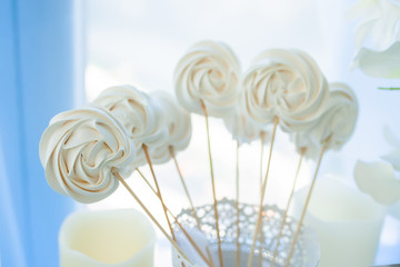White lollipops at the candy bar