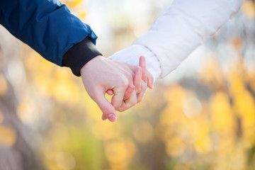 Closeup photo of couple, holding hand in hand