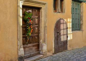 Fototapeta na wymiar Composition of autumn flowers on a wooden door