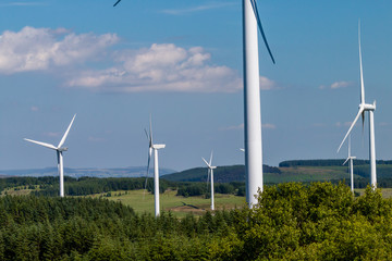 Huge wind turbines on a large land based wind farm