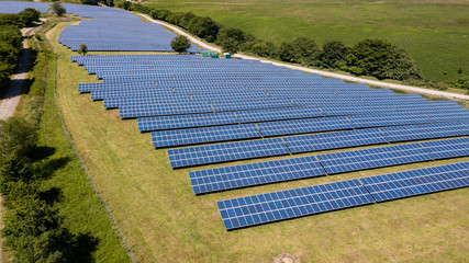 Aerial drone view of a large mountain top solar power farm