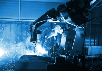  welding robot  in the automotive parts industry - obrazy, fototapety, plakaty