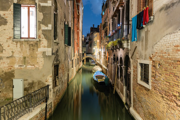 Fototapeta na wymiar View over a picturesque canal at night, Venice, Italy