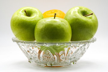 Green Apples in a crystal bowl with white background