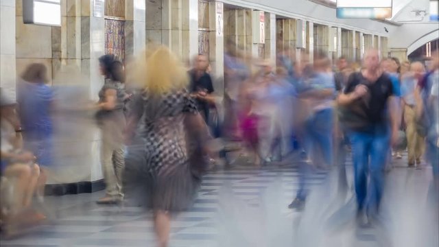 Crowd of blurry people in the subway at rush hour. Time lapse