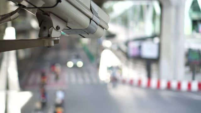 City cctv surveillance over street, people and public traffic video 4k