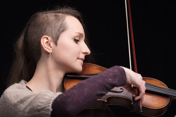 young woman playing folk violin