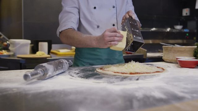 Cook Making Pizza In Italian Restaurant Kitchen Food Preparation. Shot on Red Helium 8K