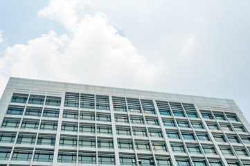 Bottom view of White Old Building with sky background