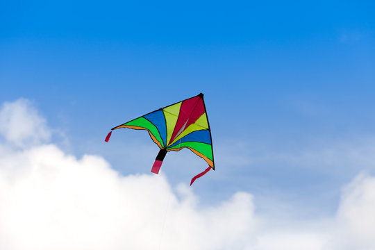 colorful kite before blue sky
