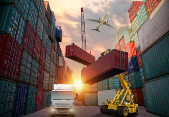 Logistics and transportation of Container Cargo ship and Cargo plane with working crane bridge in shipyard at sunrise, logistic import export and transport industry background