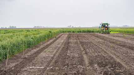 Tractor seeding an open plot of land