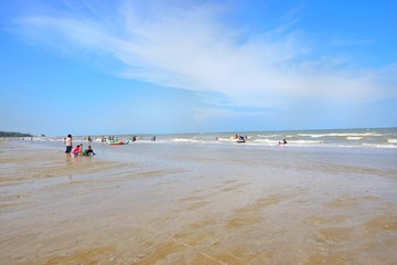 PRACHUAP KHIRI KHAN, THAILAND - APRIL 20, 2018 : People playing the sea at cha am beach. Many...