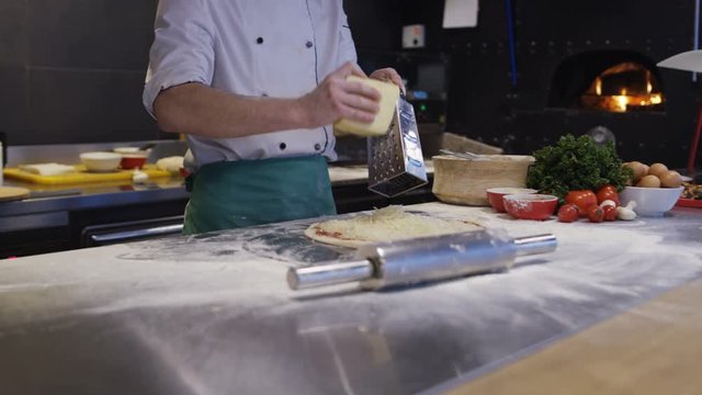 Cook Making Pizza In Italian Restaurant Kitchen Food Preparation. Shot on Red Helium 8K