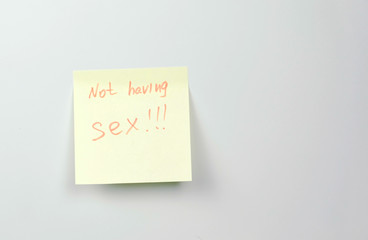 Note on yellow sticker paper sheets with words not having sex.