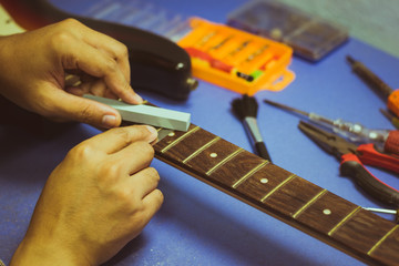electric guitar on guitar repair desk