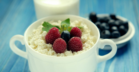 Russian cottage cheese with berry and mint, blueberries and coffee. Great breakfast.