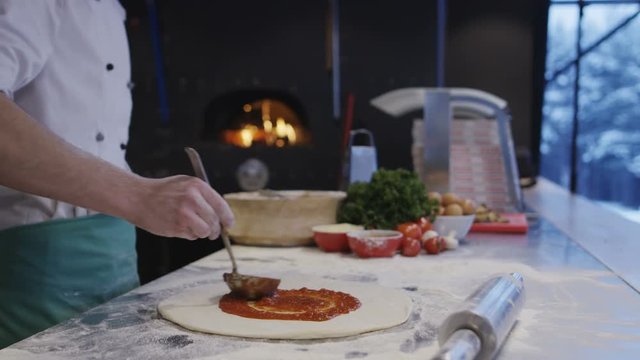 Cook Making Pizza In Italian Restaurant Kitchen Food Preparation. Shot on Red Helium 8K