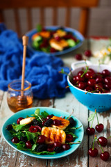 Grilled halumi  cheese salad with berries.