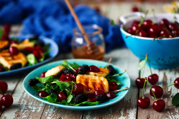 Grilled halumi  cheese salad with berries.