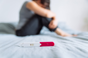 negative pregnancy test. sad woman on background - obrazy, fototapety, plakaty