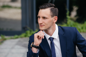 Portrait of a beautiful business man in a blue suit.