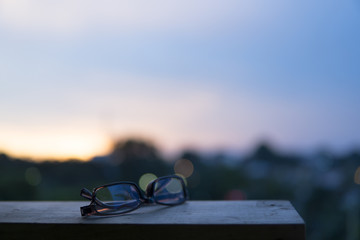 A eyewear glasses with sunset background.