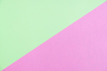 Pastel colored paper flat lay top view, background texture, green and pink