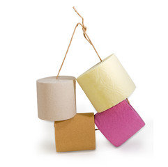 Rolls of various toilet paper different colors on twine