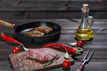 Pork steaks on cutting board