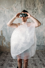Freak man wearing swimming goggles