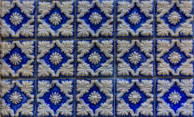 Detail of old traditional ornate portuguese decorative azulejo tiles with relief