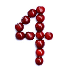 Number four. A figure composed of cherries isolated on a white background.