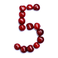 Number five. A figure composed of cherries isolated on a white background.