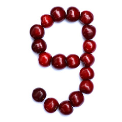 Number nine. A figure composed of cherries isolated on a white background.