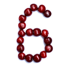 Number six. A figure composed of cherries isolated on a white background.