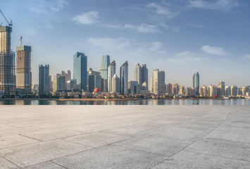 Urban skyscrapers with empty square floor tiles