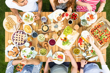 Top view on table with healthy food during meeting of friends