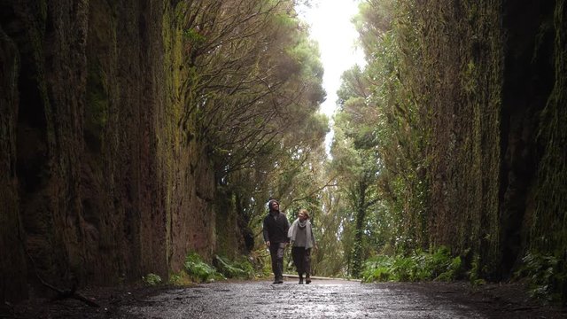 Young couple tourists walking the tracking rout in Anaga nature park in Tenerife