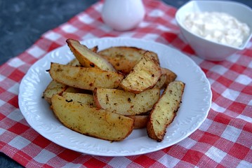 Potatoes baked with slices of spices. Served with cheese-garlic sauce