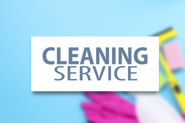 Accessories for cleaning, gloves, sponges, scraper for cleaning windows, spray on a blue background. Added text Cleaning service. cleaning service concept. Flat lay, Top view