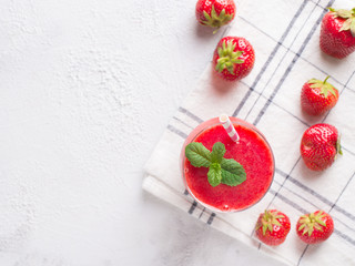 Strawberry smoothie and fresh raw berries