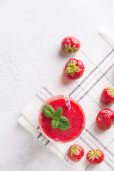 Strawberry smoothie and fresh raw berries