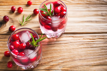 Cranberries cocktails with ice? berries and rosemary