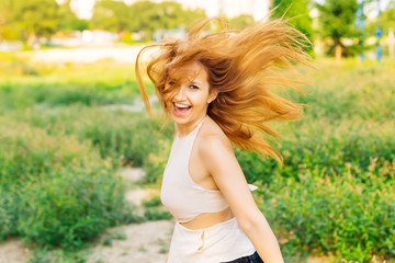 Obraz premium happy girl with a sincere smile jumping and looks into the camera lens