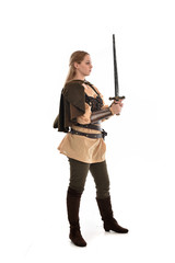 full length portrait of girl wearing brown medieval costume,. standing pose, isolated on white studio background.