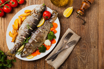 Grilled whole trout. Served with baked potatoes.