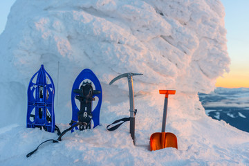 Equipment for mountaineering in the background of snow