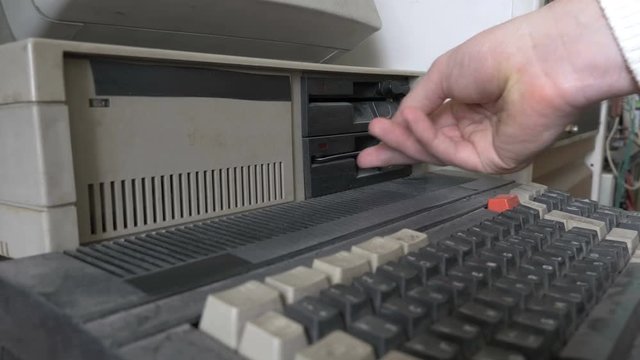 Old pc. The inserting and removing an old-style 5.25" floppy disk

