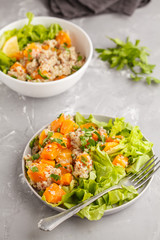 Healthy quinoa salad with roasted pumpkin and greens. Superfood and clean eating concept.